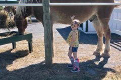 Little-girl-petting-Rusty